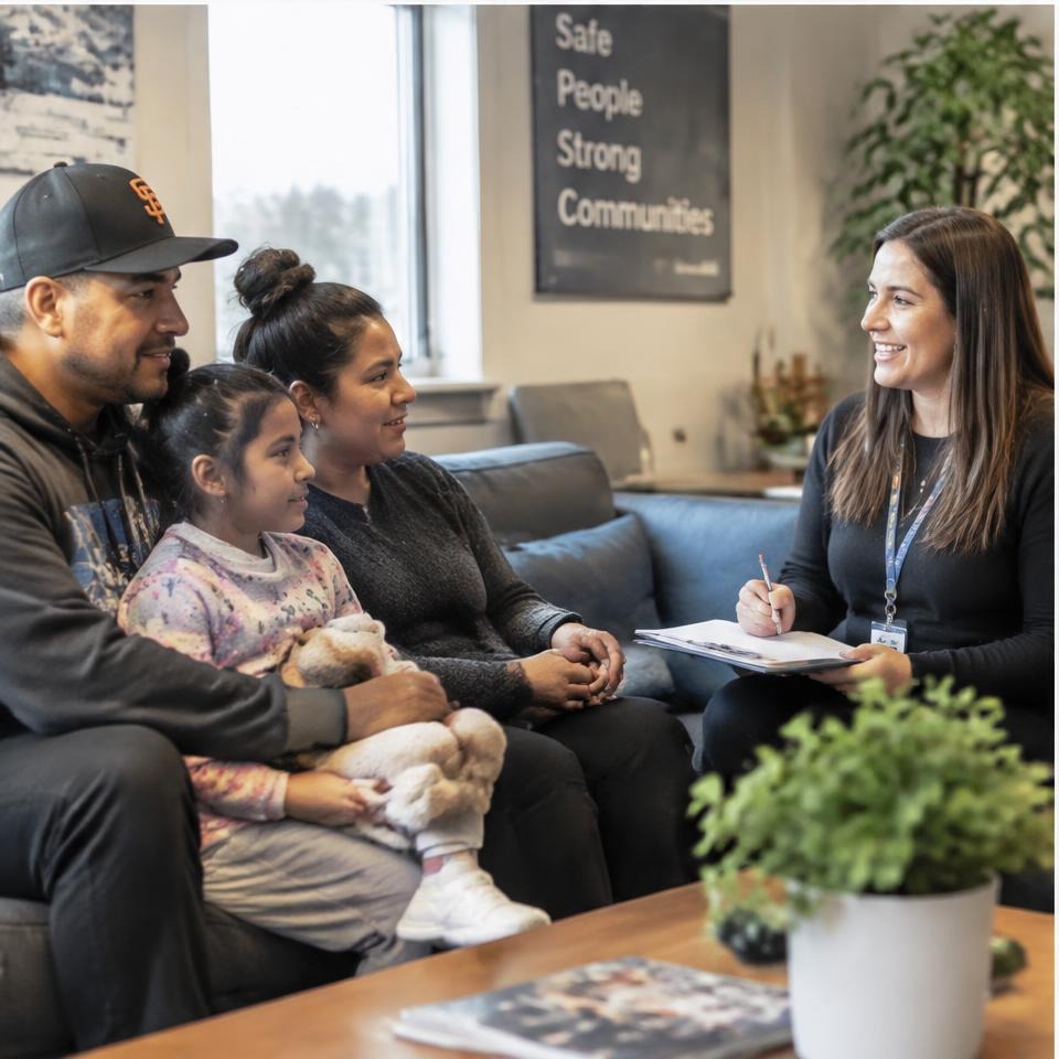 Case worker meeting with a family in a shelter